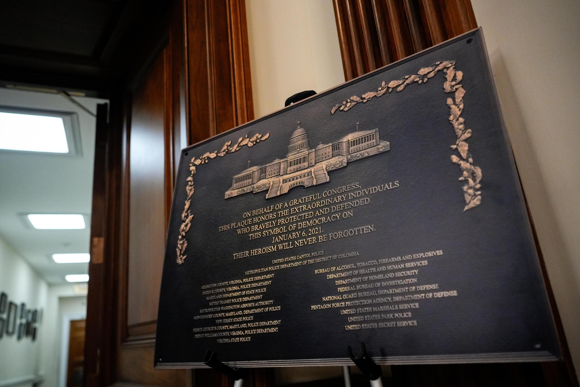 A replica plaque commemorating the Jan. 6, 2021 Capitol riot stands outside the office of House Minority Leader Hakeem Jeffries, D-N.Y, Tuesday, Dec. 30, 2025, at the U.S. Capitol in Washington. (AP Photo/Julia Demaree Nikhinson)
