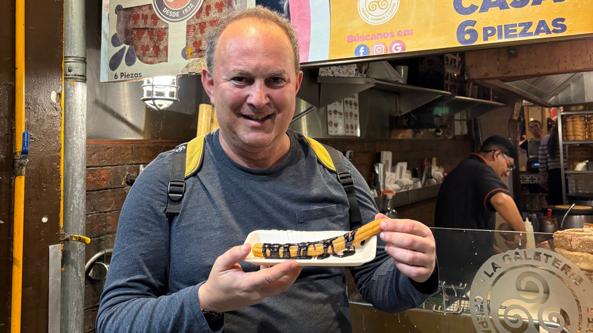 The only thing better than ending a food tour with a churro dipped in chocolate is having a second churro dipped in chocolate immediately after. (Photo by Gia Rosenblum)
