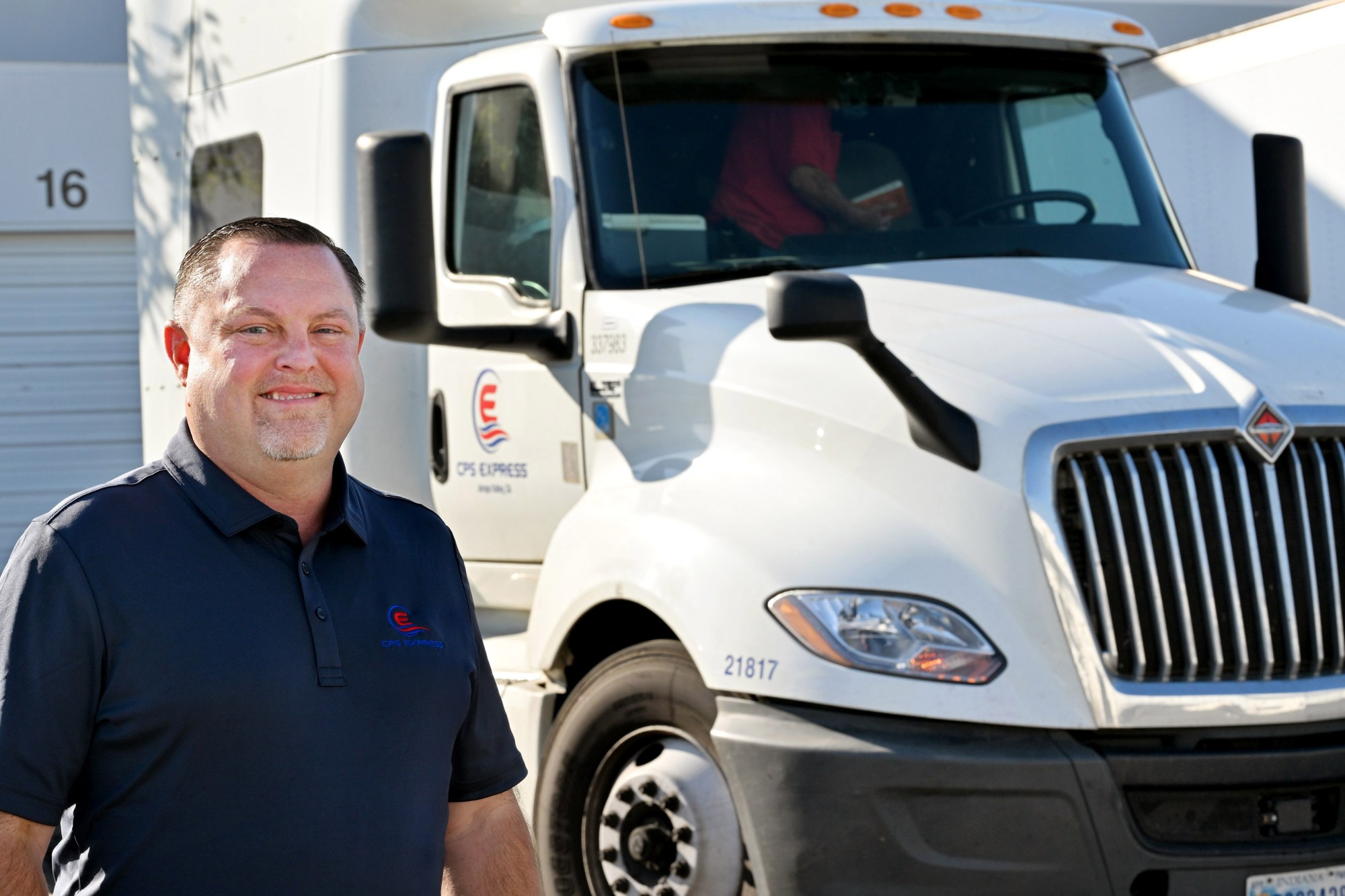 Tim Pollock, president of CPS Express trucking and logistics company in Ontario and president of the California Trucking Association, stands beside one of his company’s semi-trucks outside CPS Express on Monday, Dec. 15, 2025. (Photo by Milka Soko, Contributing Photographer)
