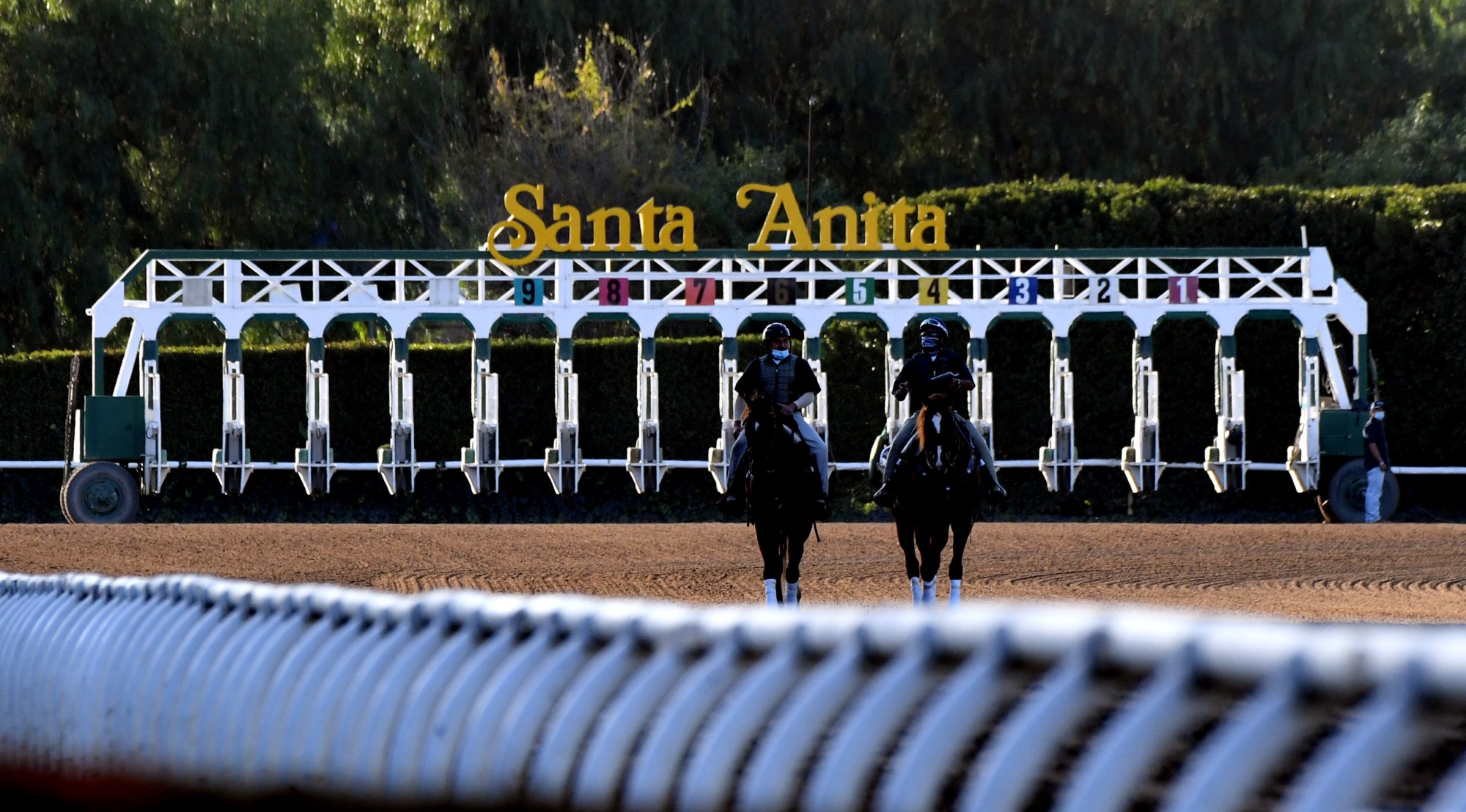 Outriders ride along the track during horse racing at Santa Anita Park in Arcadia on Saturday, March 6, 2021. (Photo by Keith Birmingham, Pasadena Star-News/SCNG)

